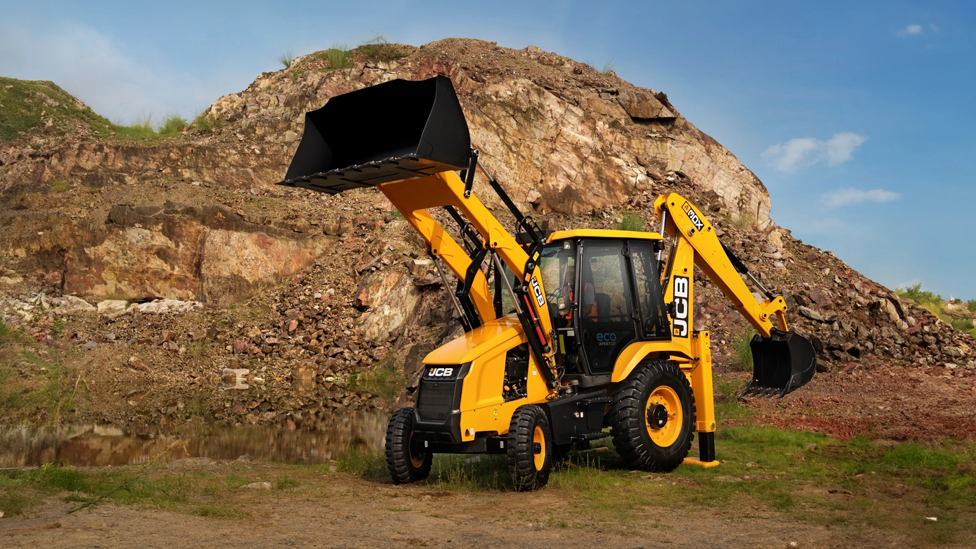 JCB backhoe arm excavating foundation and utility trenches